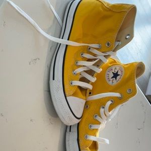 Yellow converse high tops